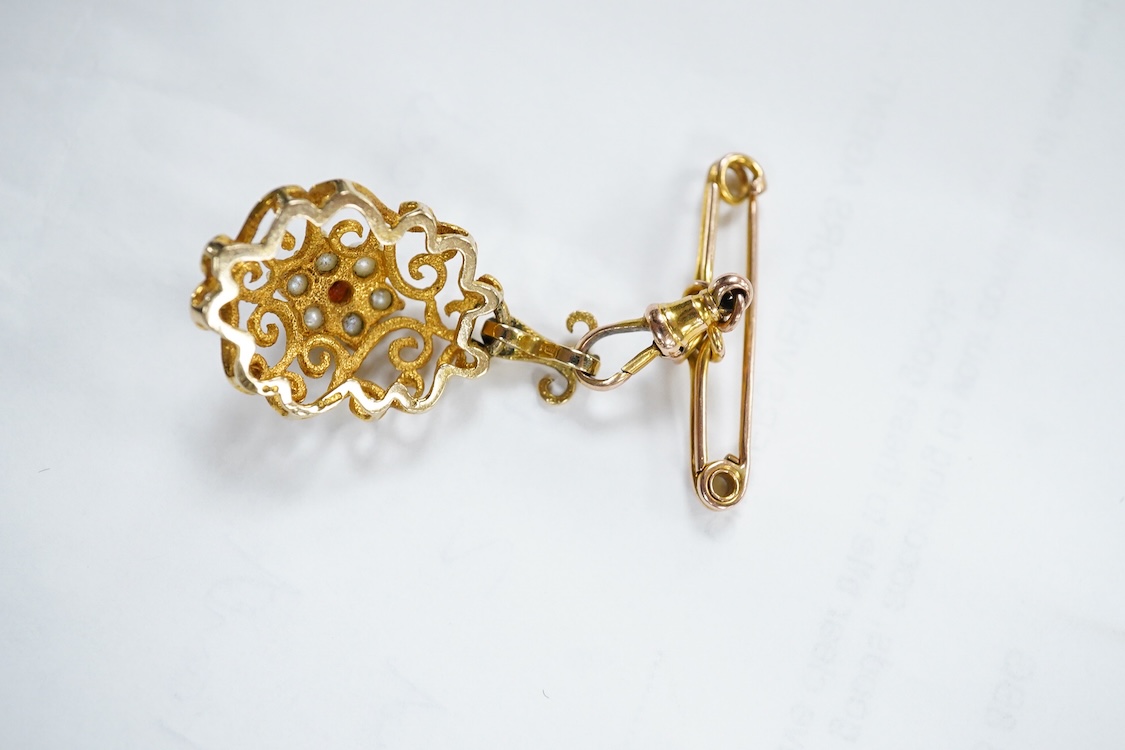 A yellow metal stick pin, the terminal modelled as a Knight's arm holding a scroll(a.f.), 79mm, together with two pairs of yellow metal and gem set ear clips including 9ct and opal doublet.